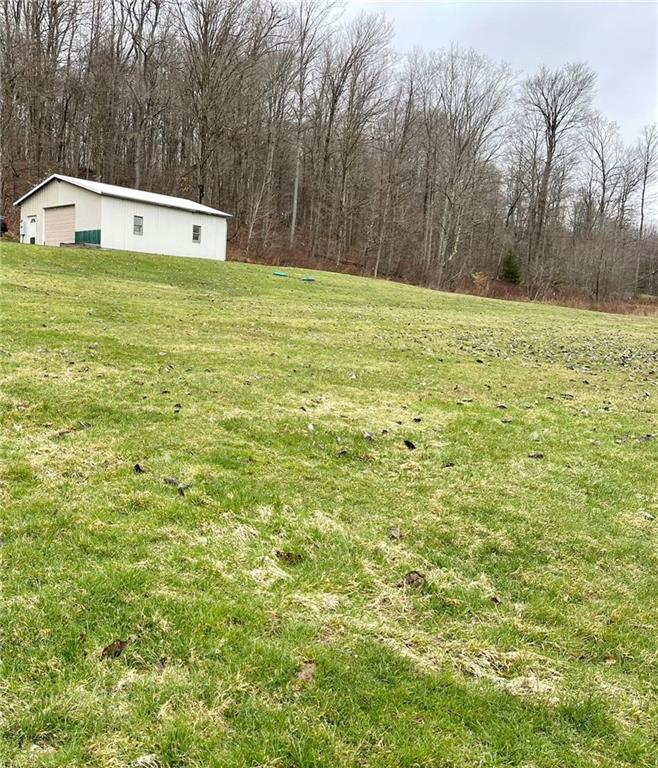 34030 State Rte 27 Guys Mills, PA 16327 - Photo 8 of 21 a backyard of a house with lots of green space and fountain