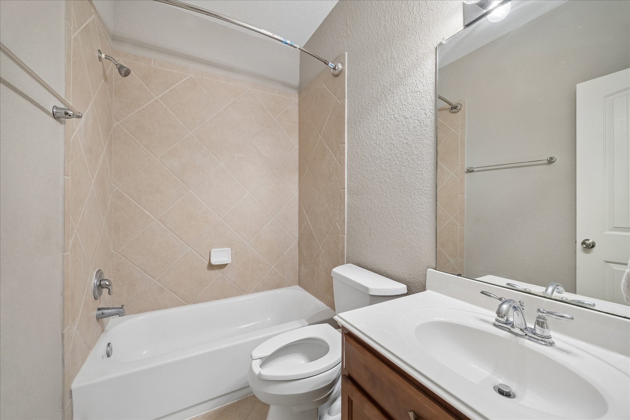 13006 Millstream Bend Lane Tomball, TX 77377 - Photo 17 of 25 a bathroom with a sink toilet and shower