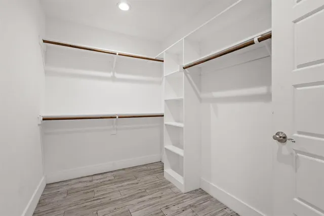 a view of an empty walk in closet
