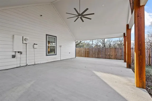 a view of a livingroom with a ceiling fan and window