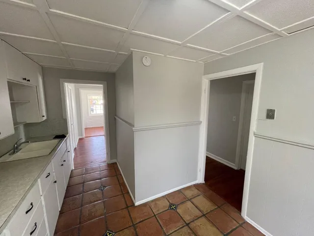 a bathroom with a sink a mirror and a shower