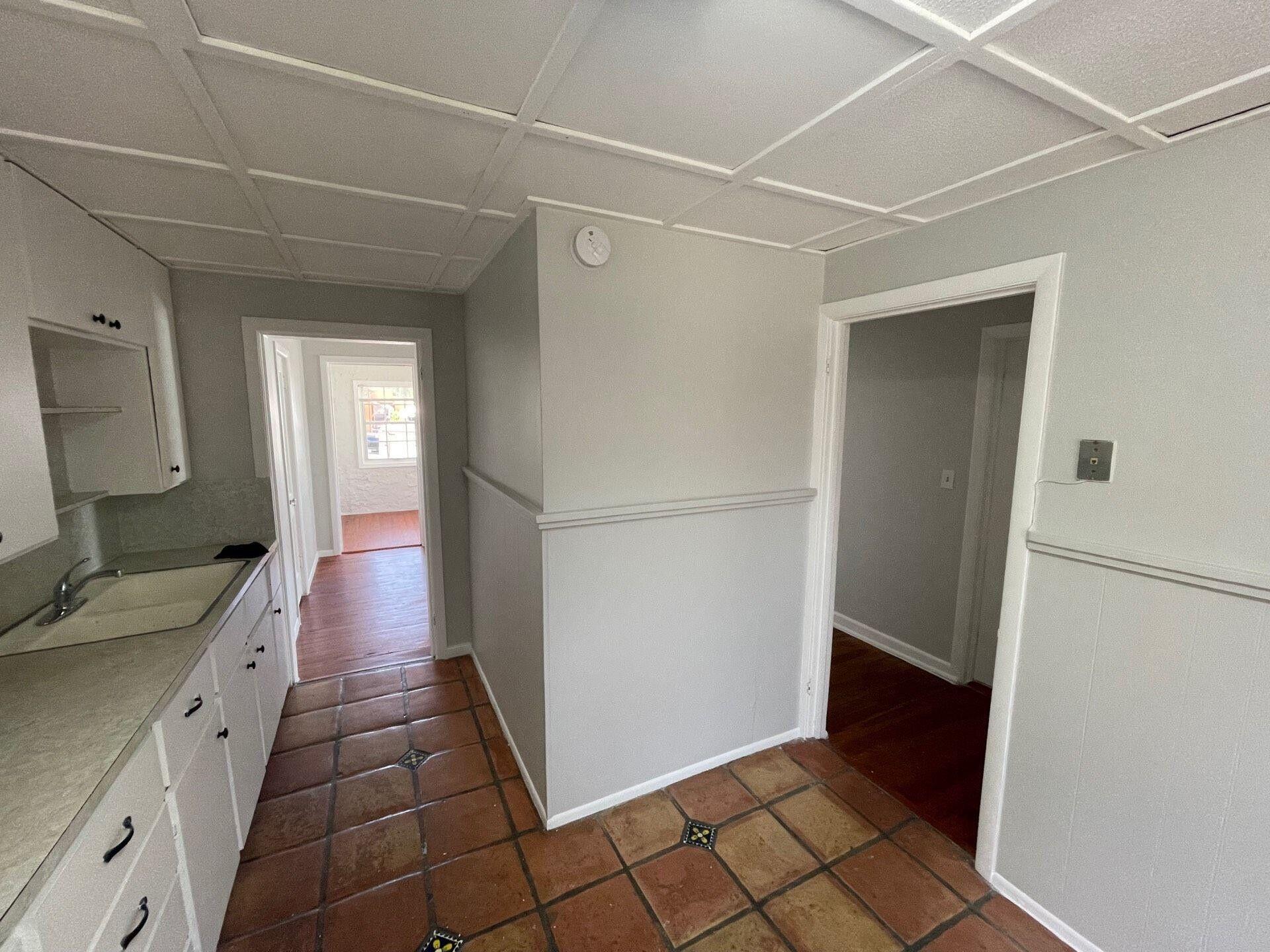 736 Omar Road, Unit 1 West Palm Beach, FL 33405 - Photo 4 of 25 a bathroom with a sink a mirror and a shower