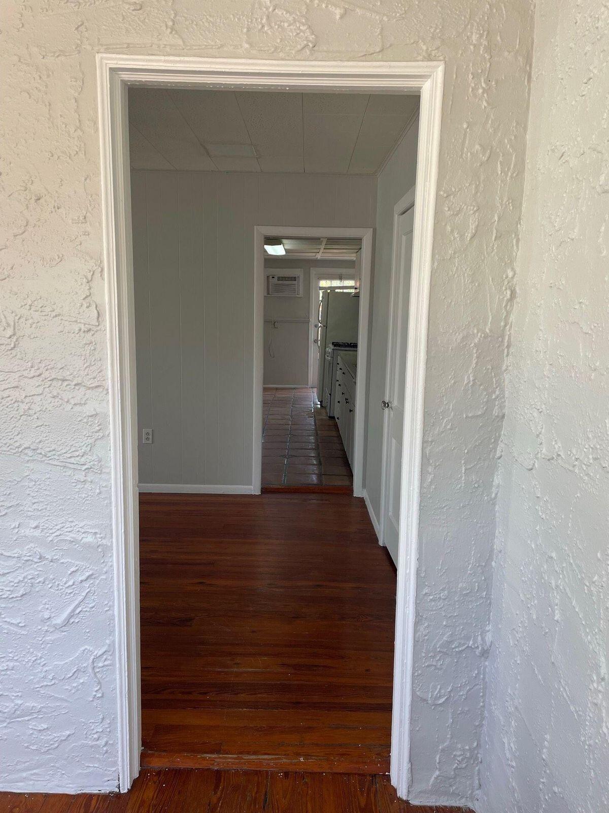 736 Omar Road, Unit 1 West Palm Beach, FL 33405 - Photo 10 of 25 a view of a hallway with wooden floor
