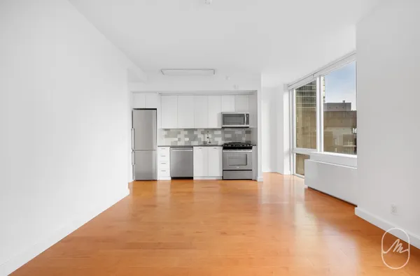 a view of kitchen with wooden floor
