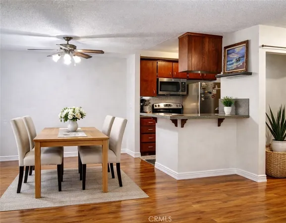 a view of kitchen with microwave stove top oven and cabinets