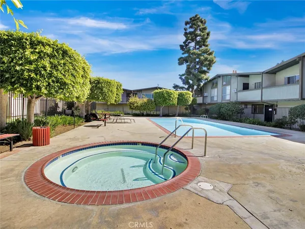 a view of a swimming pool with a patio