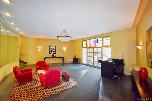 a living room with furniture or couch and a large window