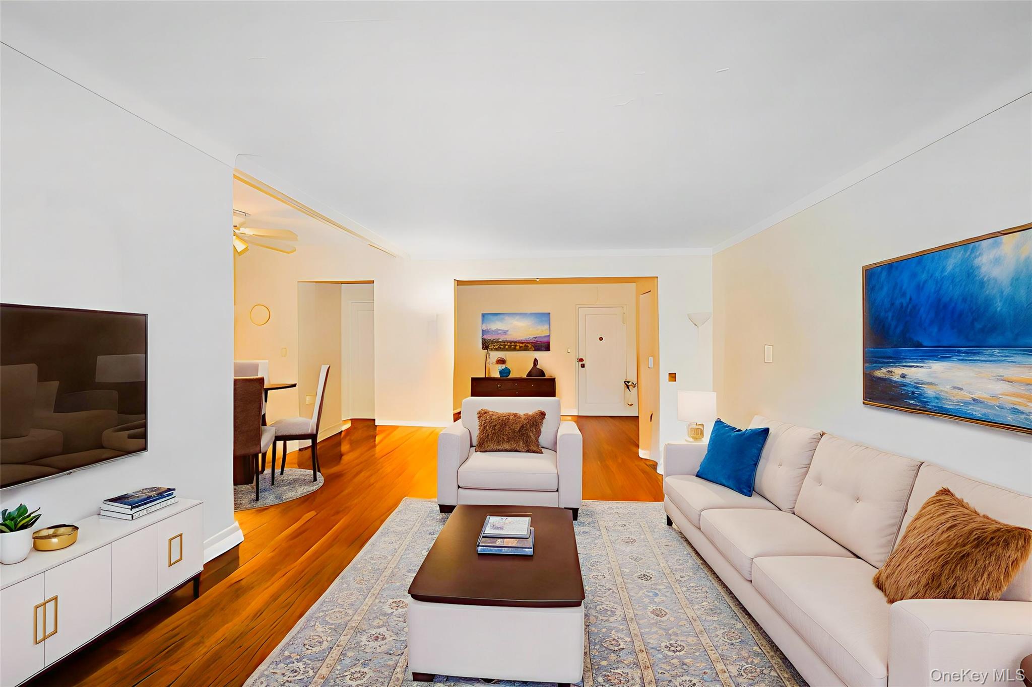3441 85th Street, Unit 3A Queens, NY 11372 - Photo 3 of 11 a living room with furniture and a flat screen tv