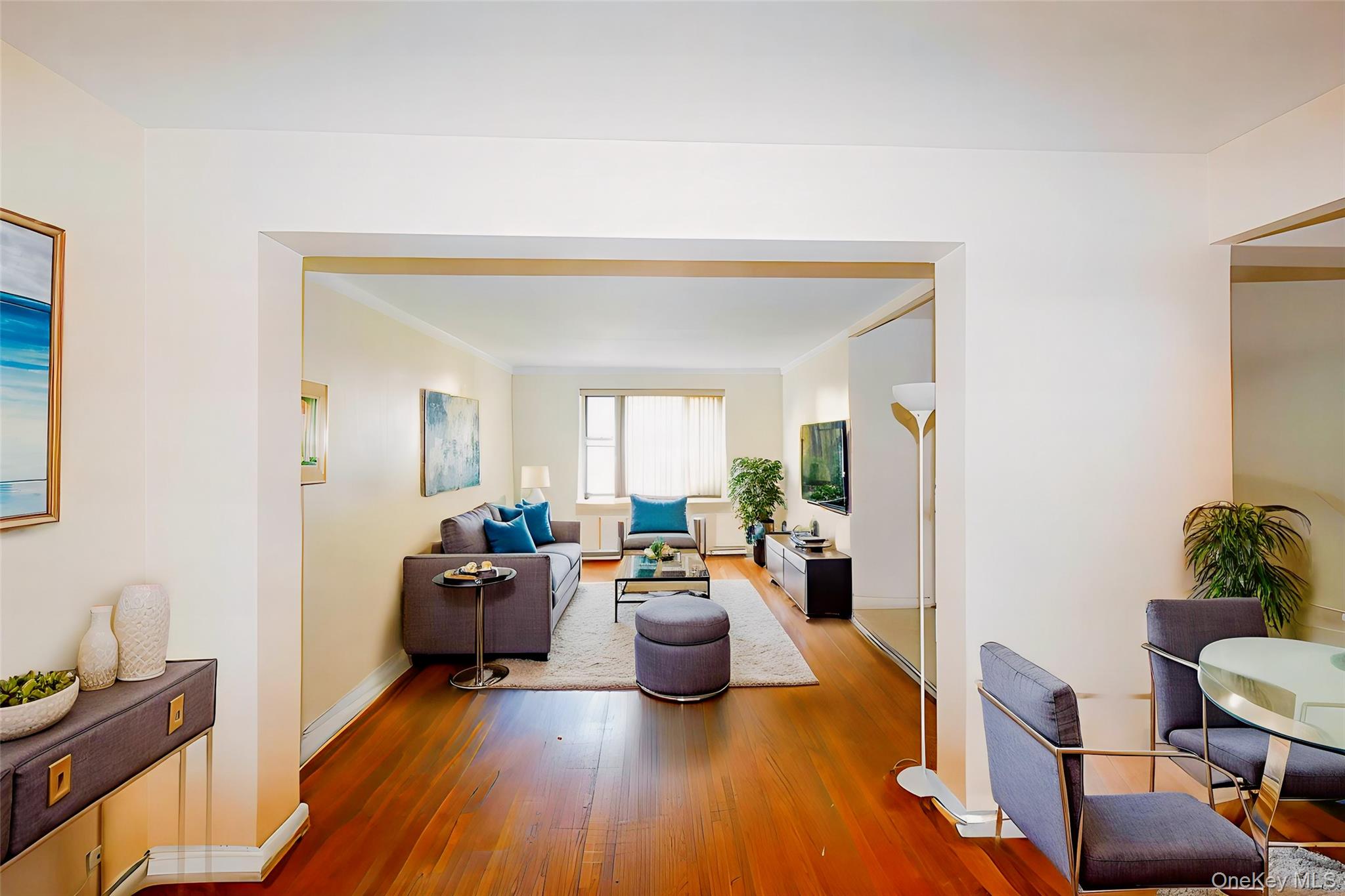 3441 85th Street, Unit 3A Queens, NY 11372 - Photo 4 of 11 a living room with furniture and a wooden floor