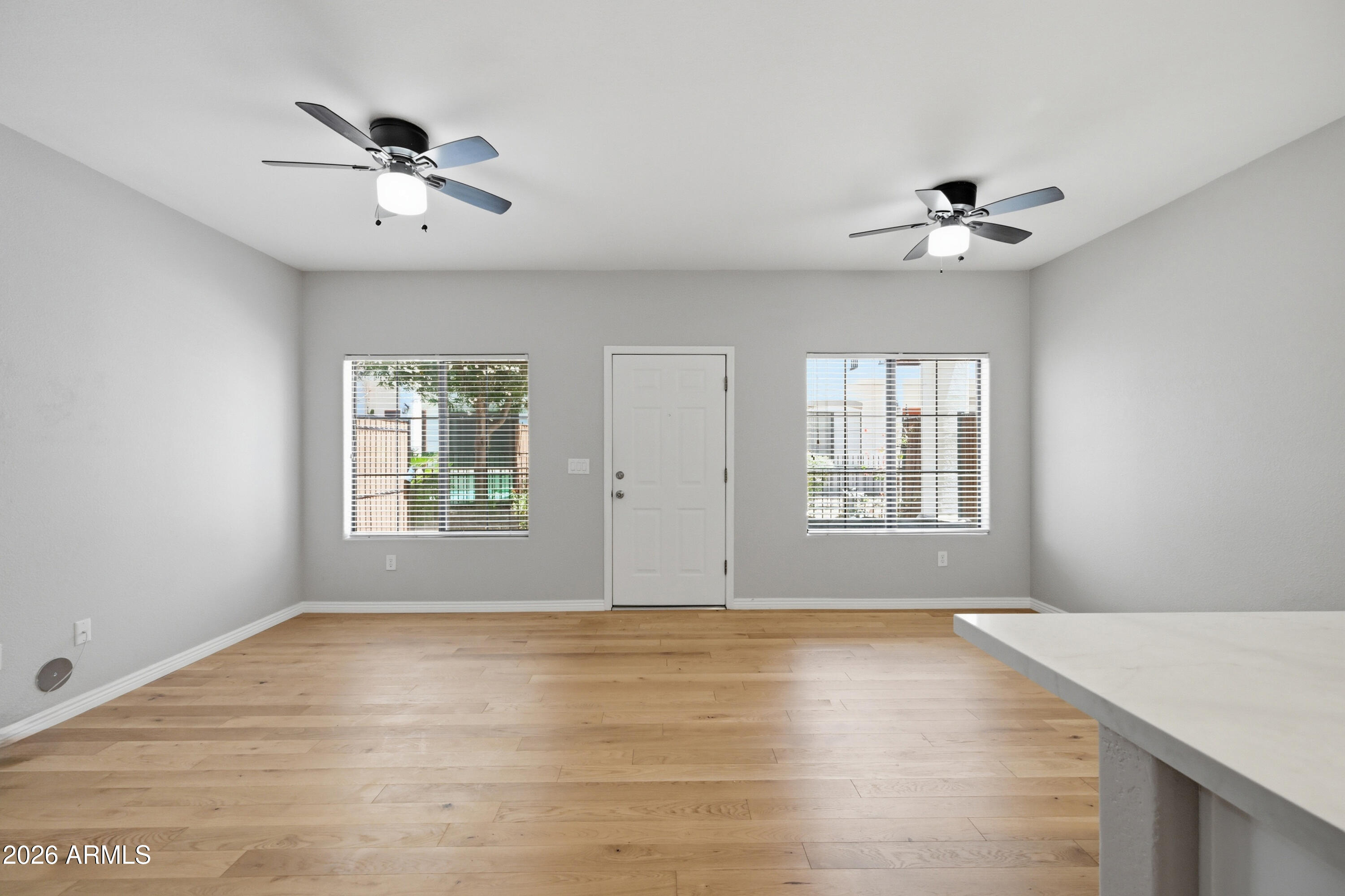 3150 East Beardsley Road, Unit 1009 Phoenix, AZ 85050 - Photo 5 of 31 a view of an empty room with a window