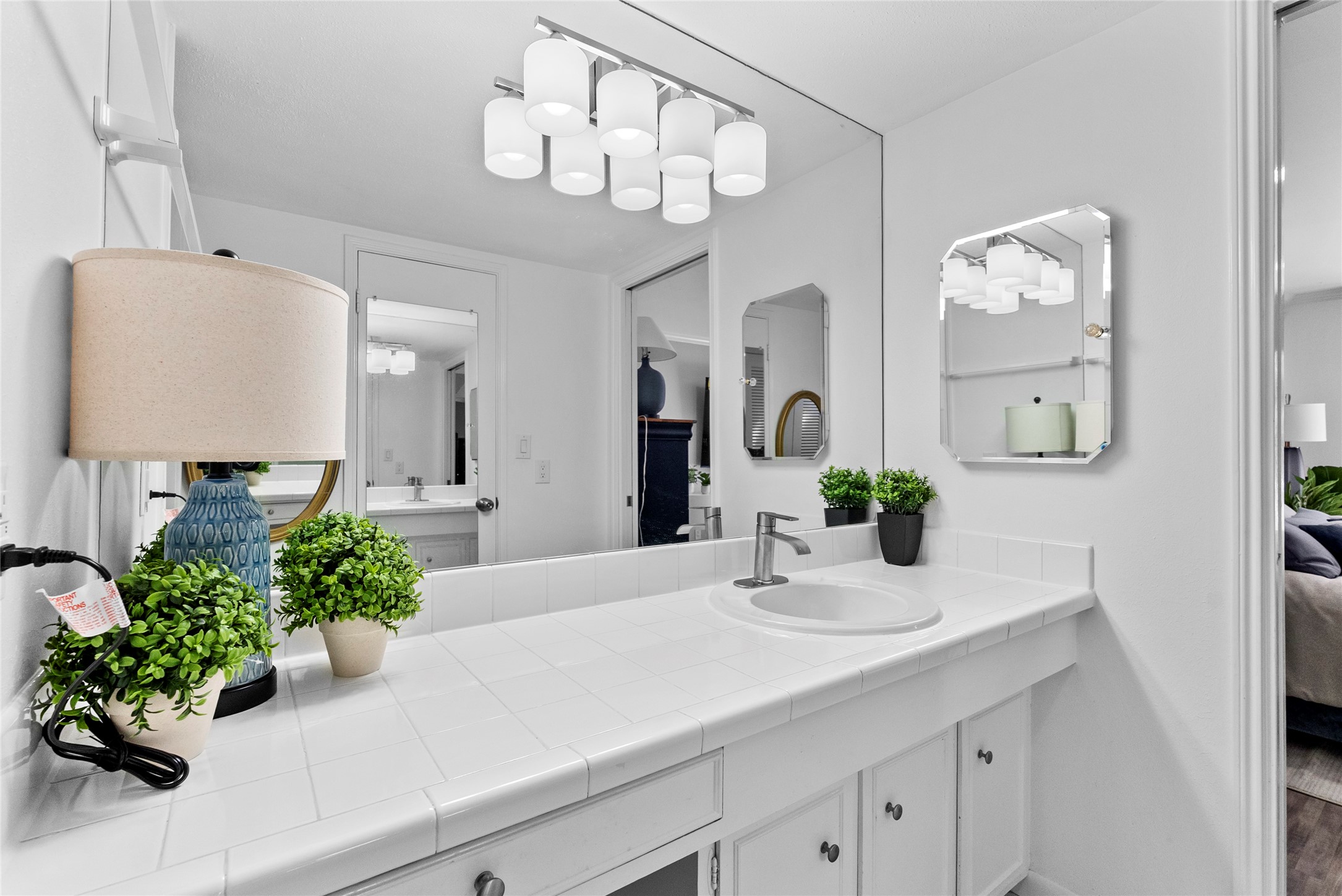 604 South Ripple Creek Drive, Unit 604 Houston, TX 77057 - Photo 19 of 31 a bathroom with a sink and a mirror