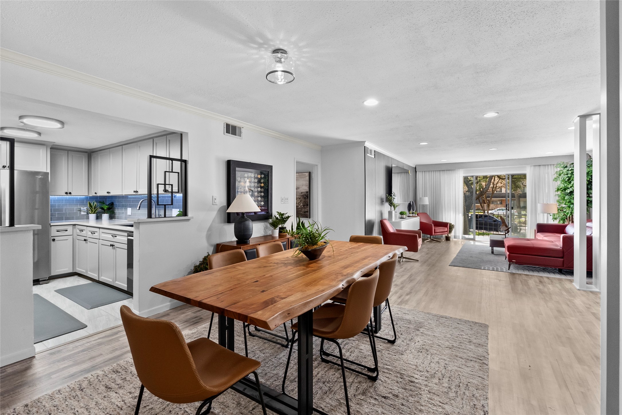 604 South Ripple Creek Drive, Unit 604 Houston, TX 77057 - Photo 2 of 31 a view of a dining room with furniture and a livingroom