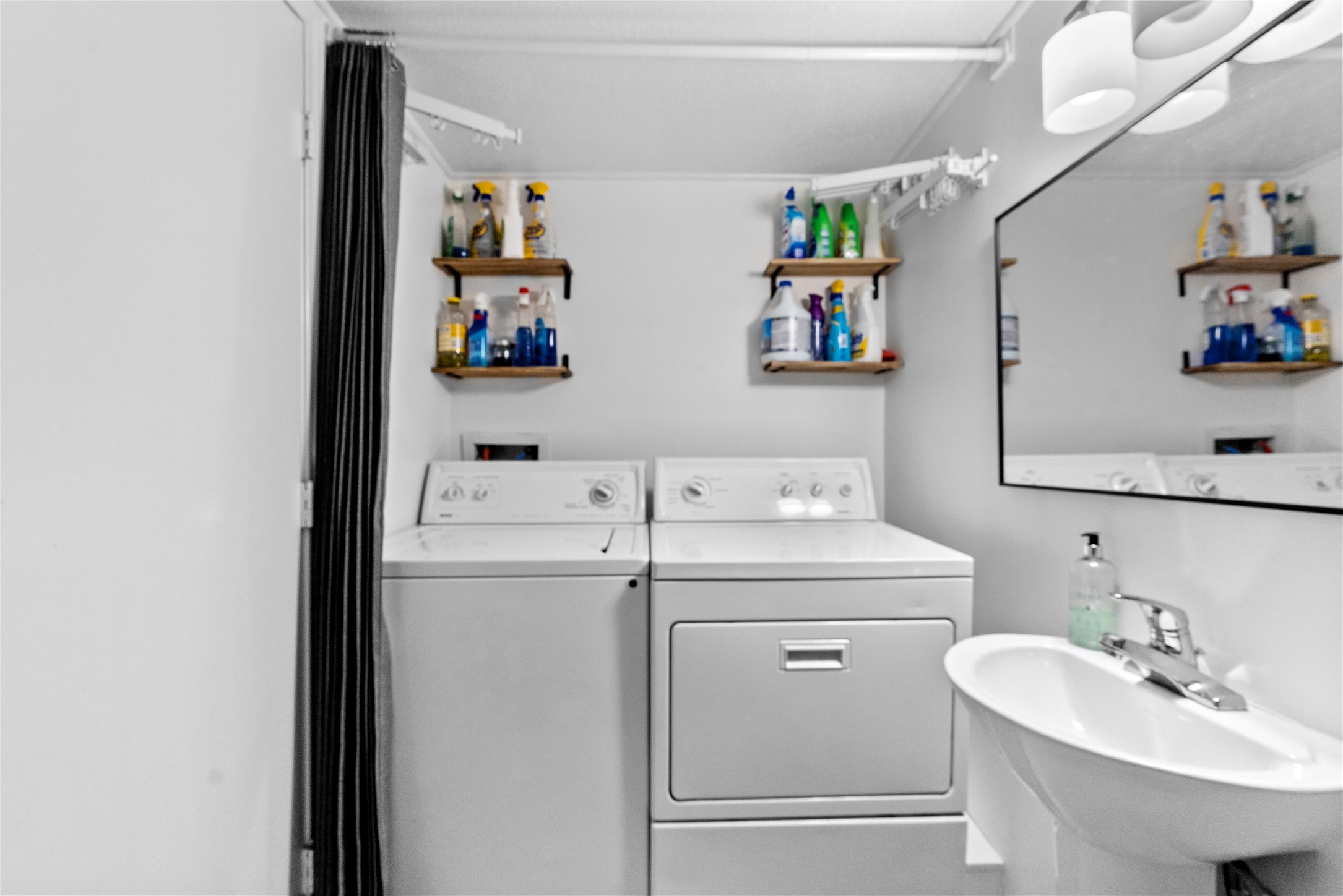 604 South Ripple Creek Drive, Unit 604 Houston, TX 77057 - Photo 26 of 31 a bathroom with a sink and a mirror
