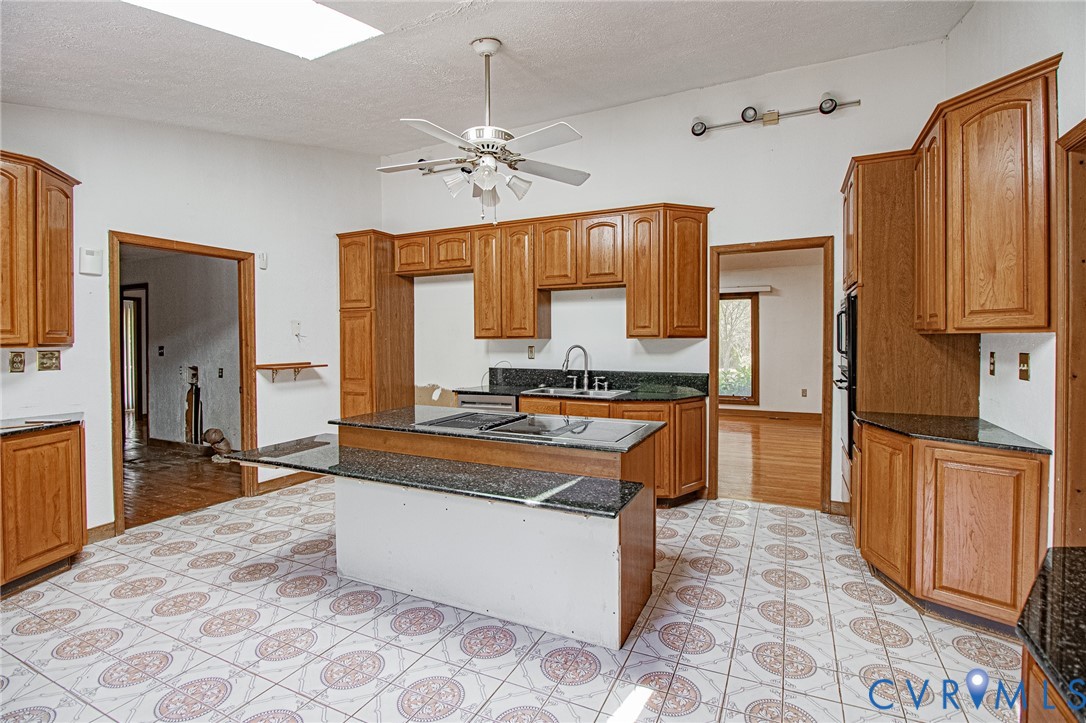 10720 Kimages Road Charles City, VA 23030 - Photo 14 of 55 a large kitchen with kitchen island granite countertop a refrigerator a stove a sink and dishwasher