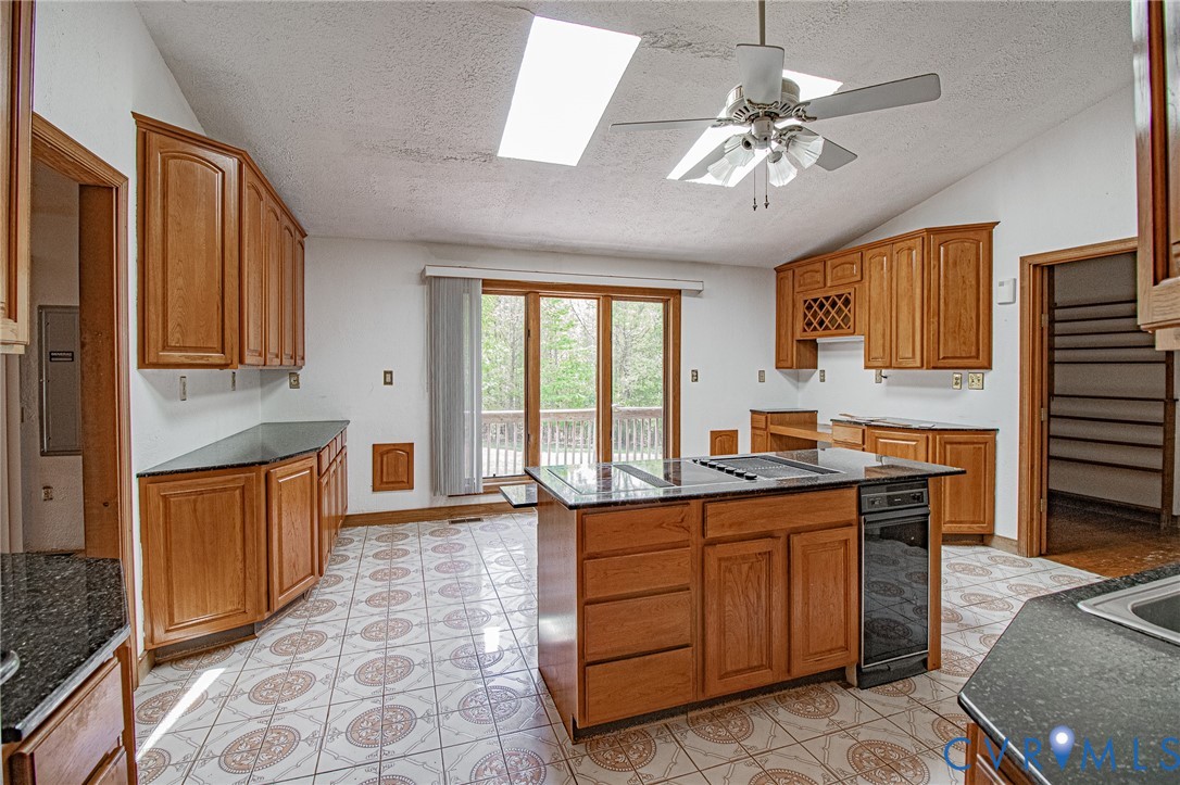 10720 Kimages Road Charles City, VA 23030 - Photo 15 of 55 a kitchen with stainless steel appliances granite countertop a sink and cabinets
