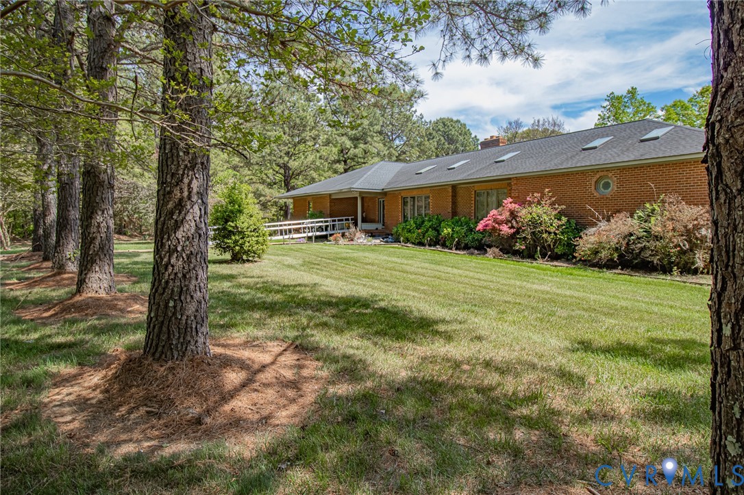 10720 Kimages Road Charles City, VA 23030 - Photo 2 of 55 a view of a house with garden