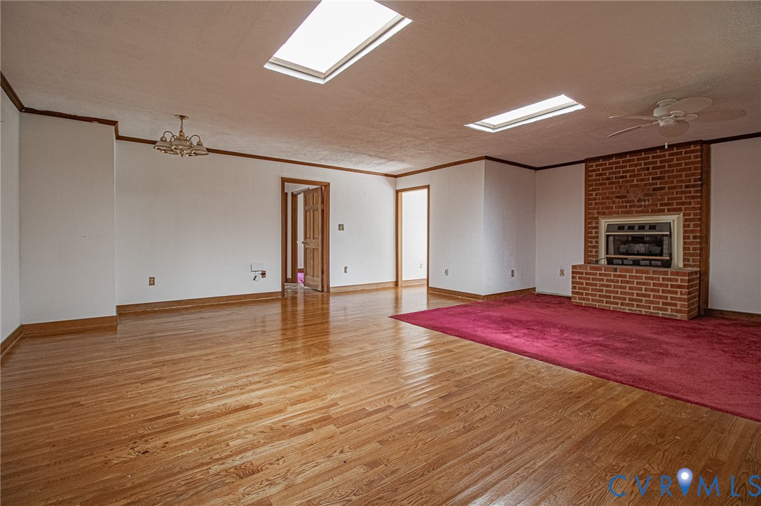 10720 Kimages Road Charles City, VA 23030 - Photo 22 of 55 a view of a livingroom with wooden floor and staircase