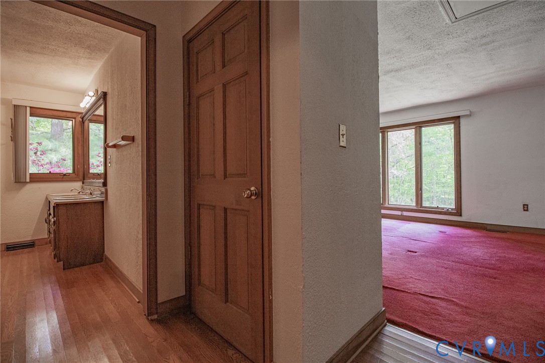 10720 Kimages Road Charles City, VA 23030 - Photo 27 of 55 a view of hallway with wooden floor