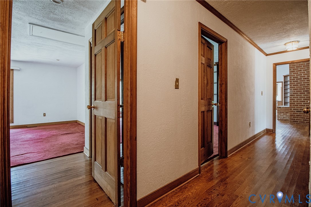 10720 Kimages Road Charles City, VA 23030 - Photo 28 of 55 a view of a hallway with wooden floor and staircase