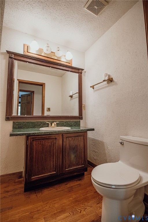 10720 Kimages Road Charles City, VA 23030 - Photo 31 of 55 a bathroom with a toilet a sink and mirror