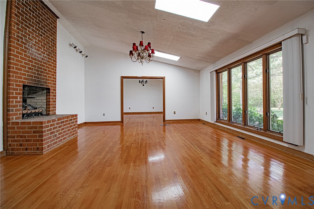 10720 Kimages Road Charles City, VA 23030 - Photo 8 of 55 wooden floor in an empty room with a window