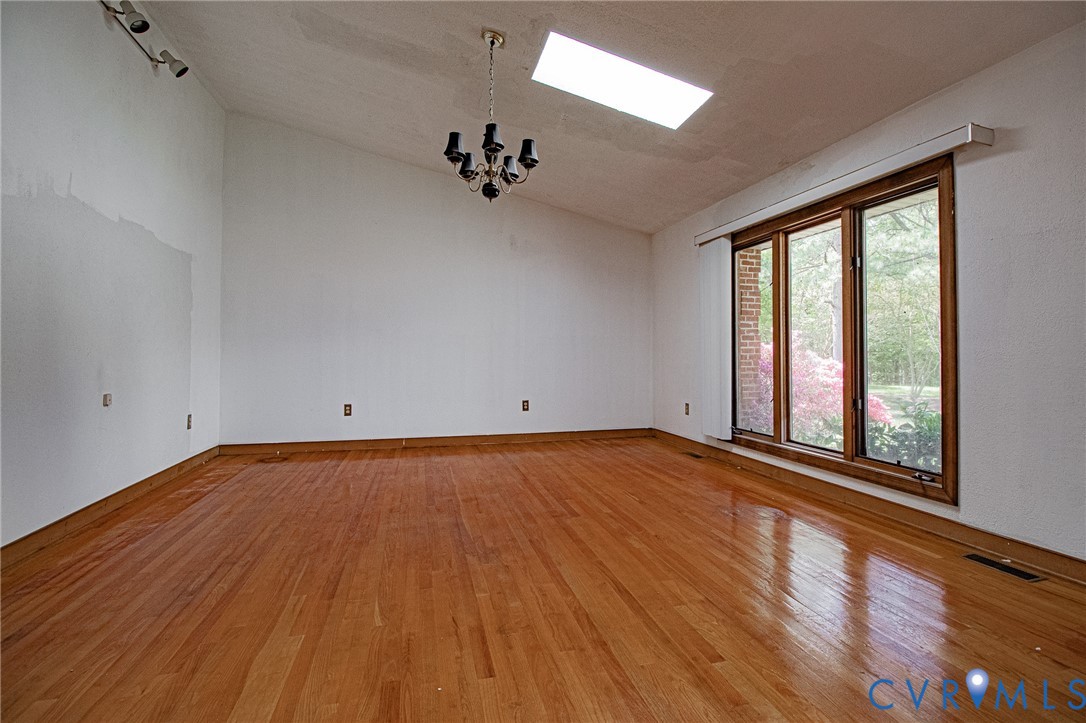 10720 Kimages Road Charles City, VA 23030 - Photo 10 of 55 wooden floor in an empty room with a window