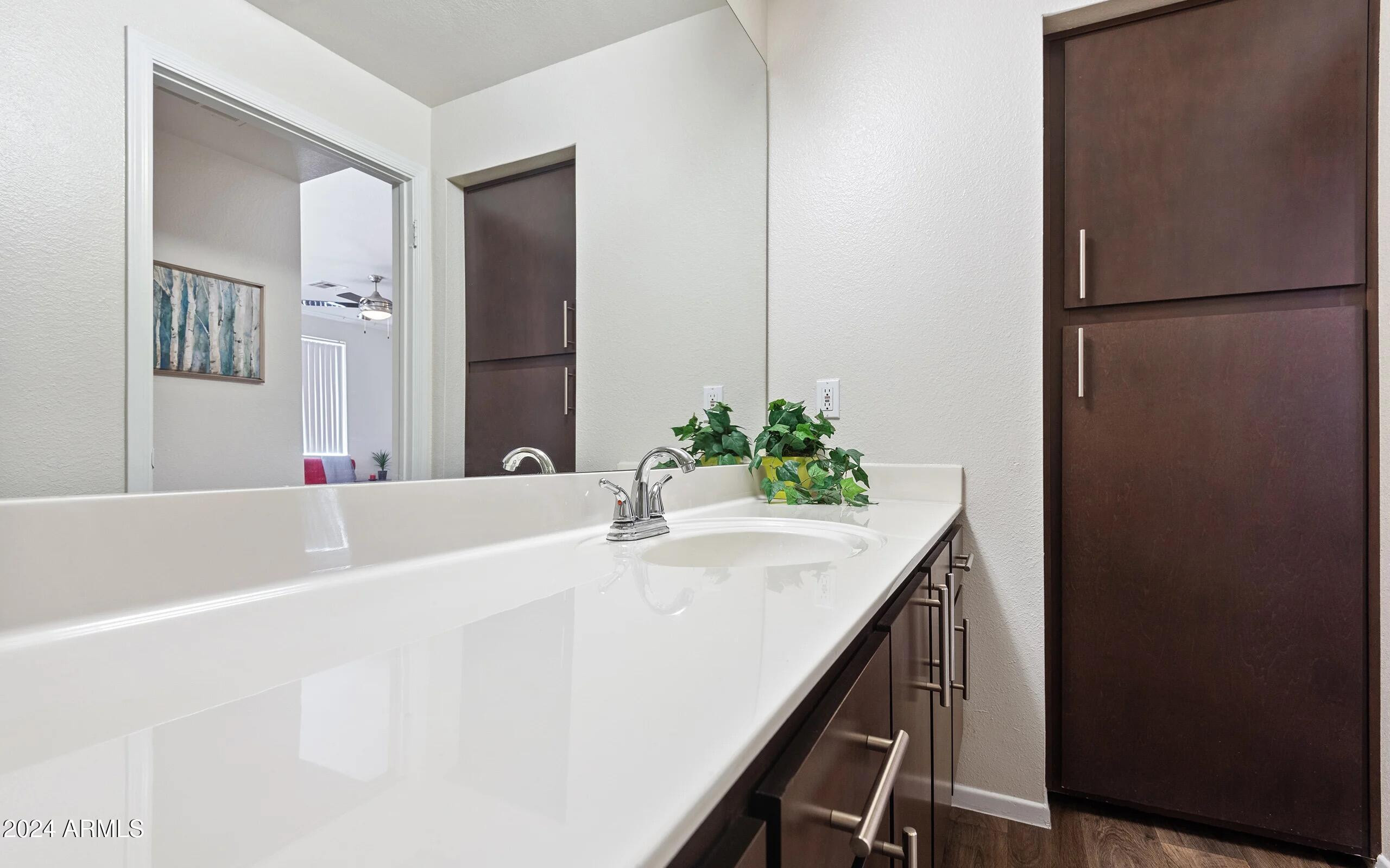 3625 East Ray Road, Unit 1 Phoenix, AZ 85044 - Photo 10 of 29 a bathroom with a tub sink and mirror