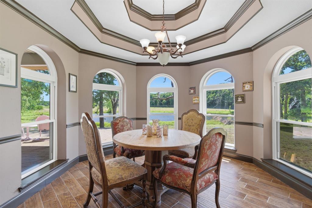 321 Cr 211 Road Gainesville, TX 76240 - Photo 12 of 40 Have morning coffee is this elevated dining area overlooking the back pond.