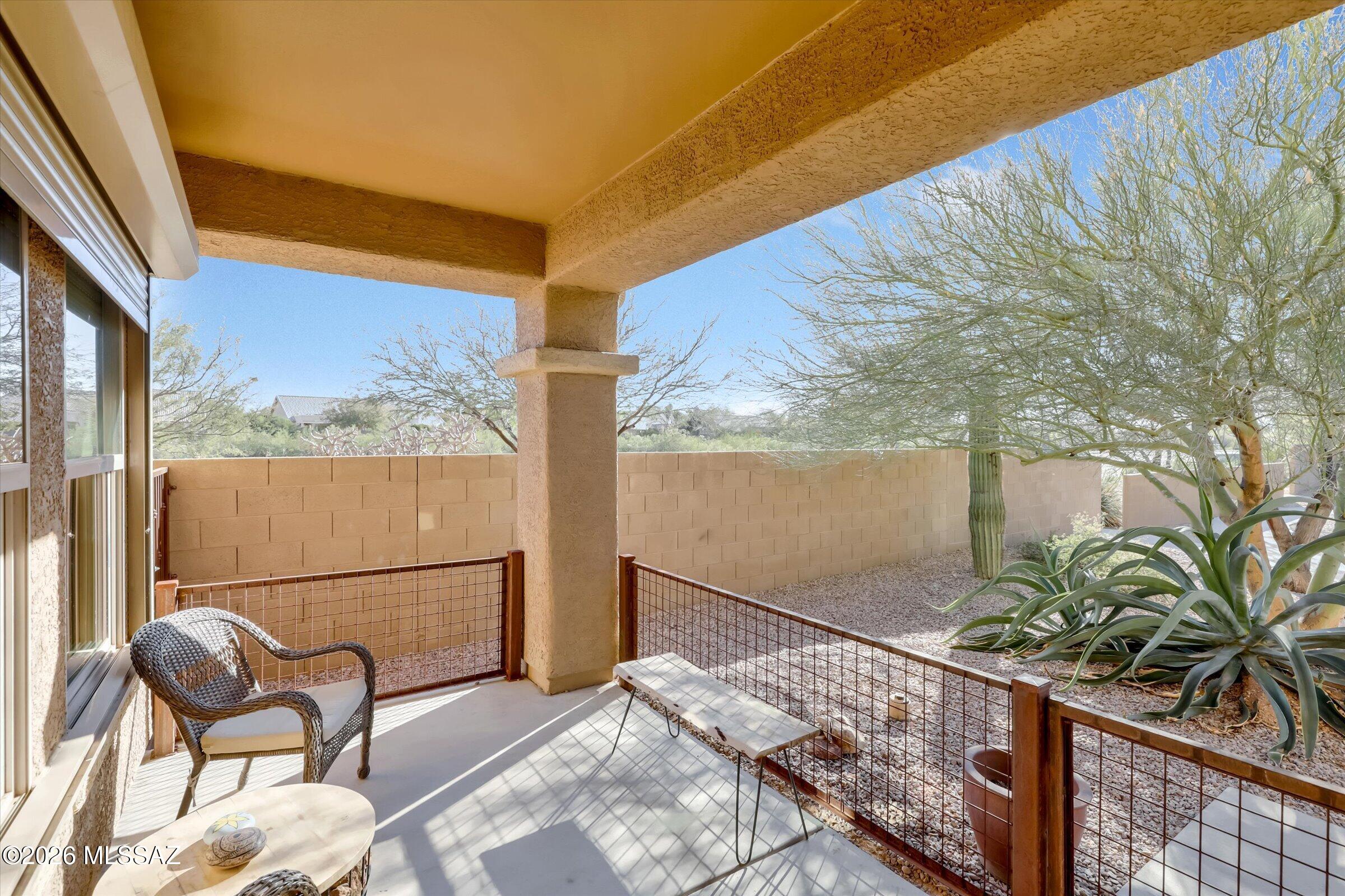 6095 South Jakemp Trail Tucson, AZ 85747 - Photo 8 of 52 a view of a two chair and table in the balcony