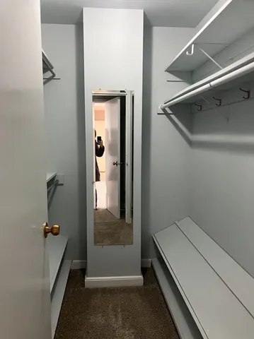 a bathroom with a tub and shower