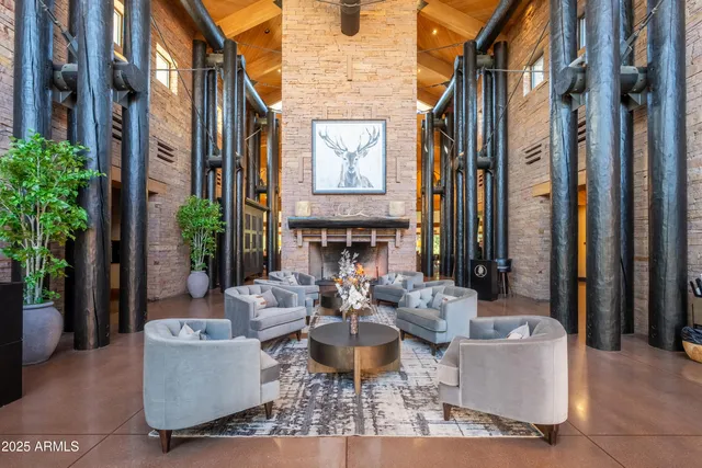 a view of a patio with a table and chairs