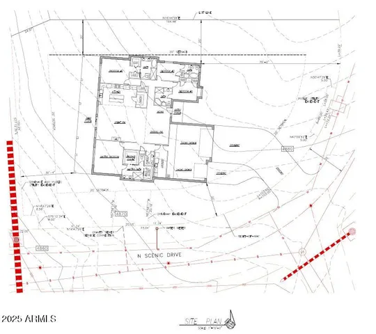 a living room with fireplace furniture and a large window