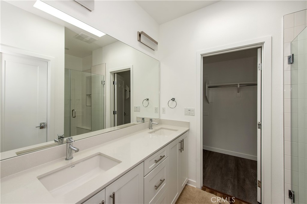 2208 Synergy Irvine, CA 92614 - Photo 12 of 22 a bathroom with a sink and a mirror
