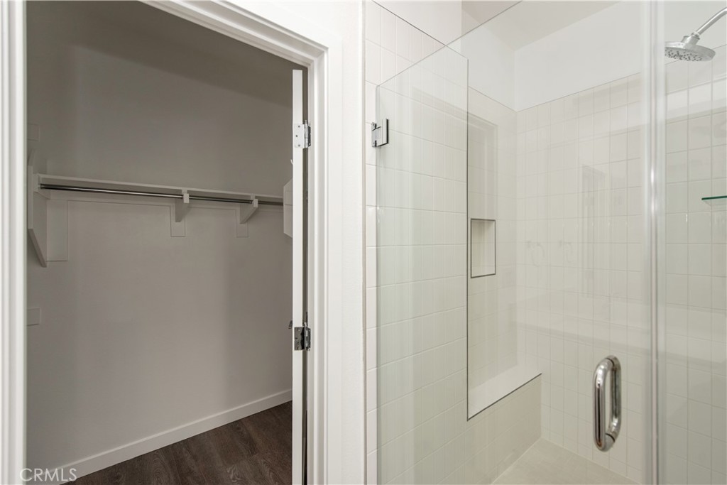 2208 Synergy Irvine, CA 92614 - Photo 17 of 22 a bathroom with a shower