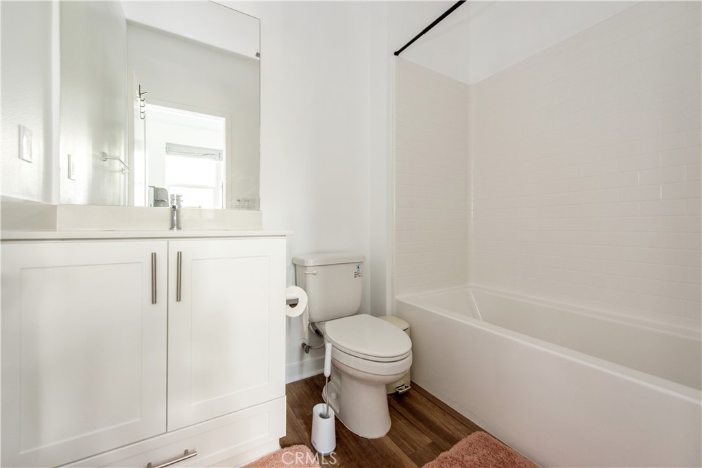 2208 Synergy Irvine, CA 92614 - Photo 18 of 22 a bathroom with a sink a toilet and shower