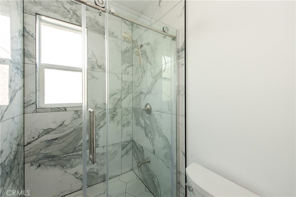 2208 Synergy Irvine, CA 92614 - Photo 8 of 22 a bathroom with a shower and toilet
