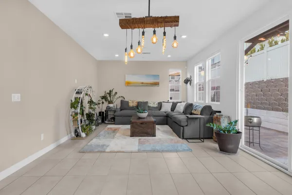 a dining room with furniture and wooden floor