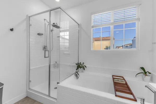 a bathroom with a bathtub and a shower