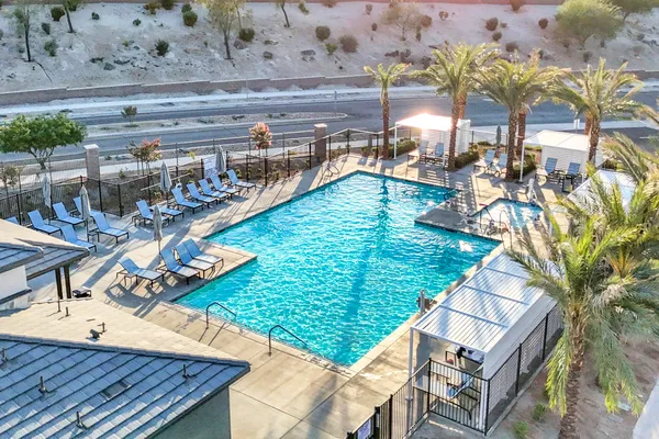 a view of a swimming pool with a patio