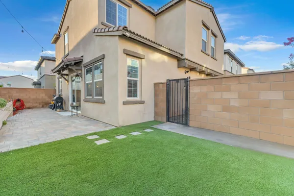 a view of a pathway both side of the house