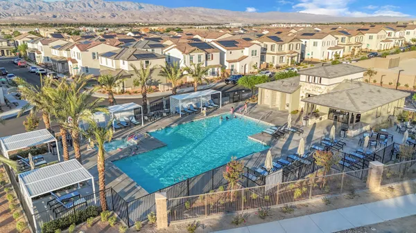 an aerial view of a residential apartment building with a yard