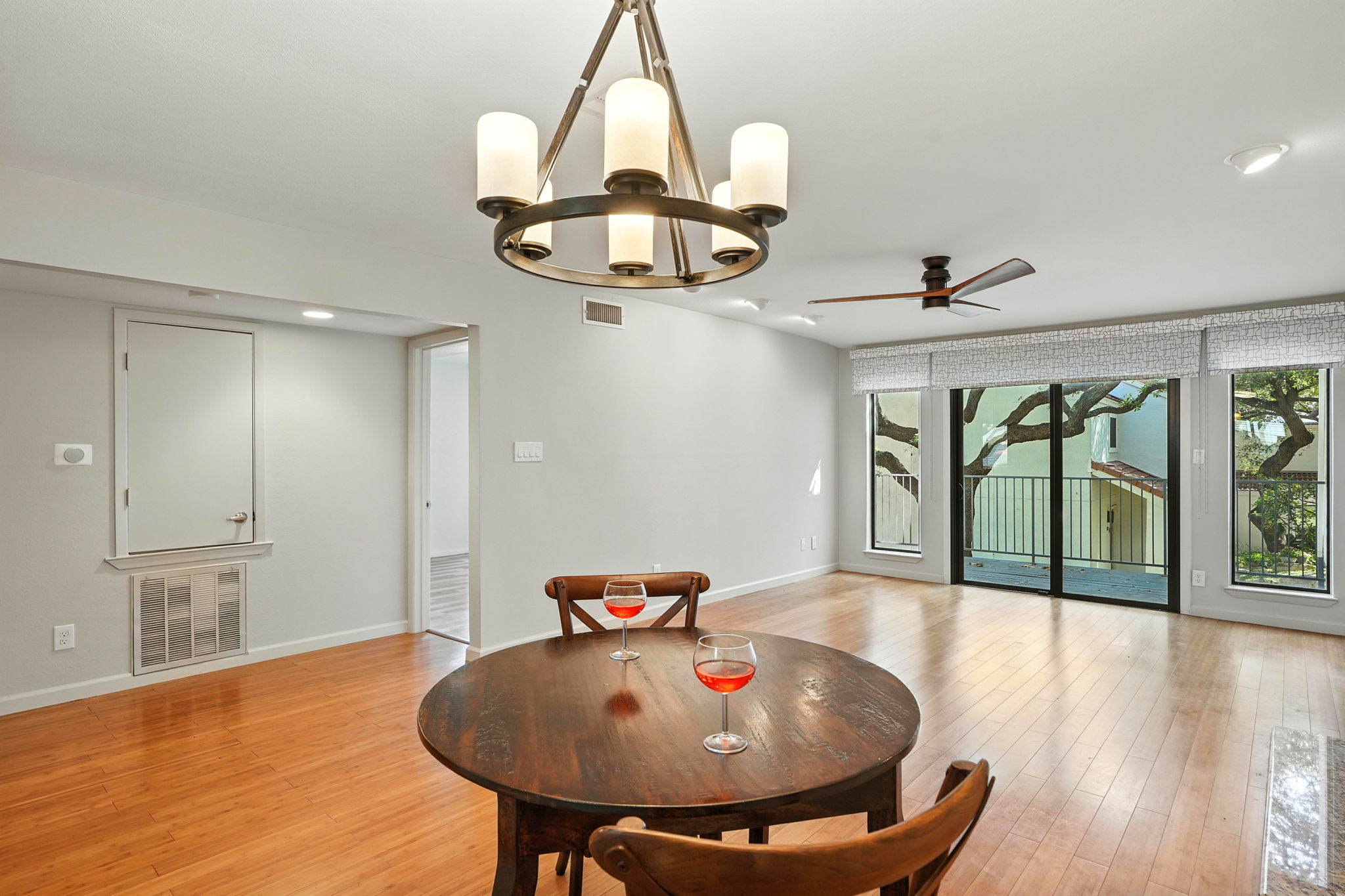 2918 Ranch Road 620 North, Unit C115 Austin, TX 78734 - Photo 14 of 39 Dining room with a chandelier, plenty of natural light, a ceiling fan, and light wood finished floors
