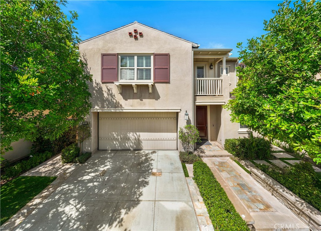 a front view of a house with yard