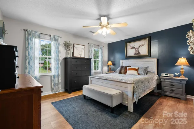 a bedroom with bed and window