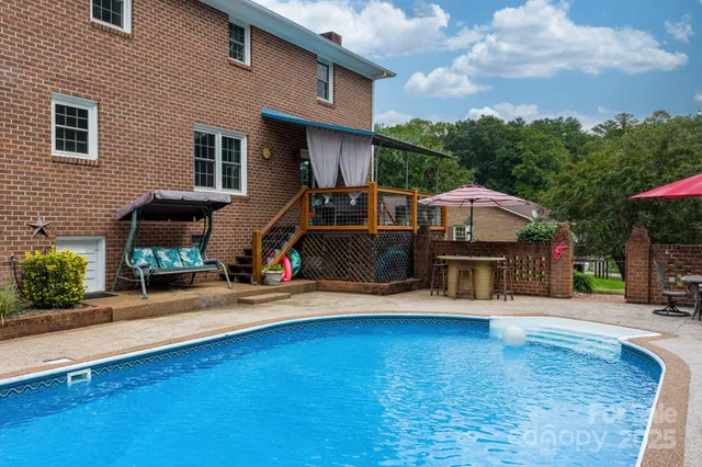 a view of a house with wooden deck