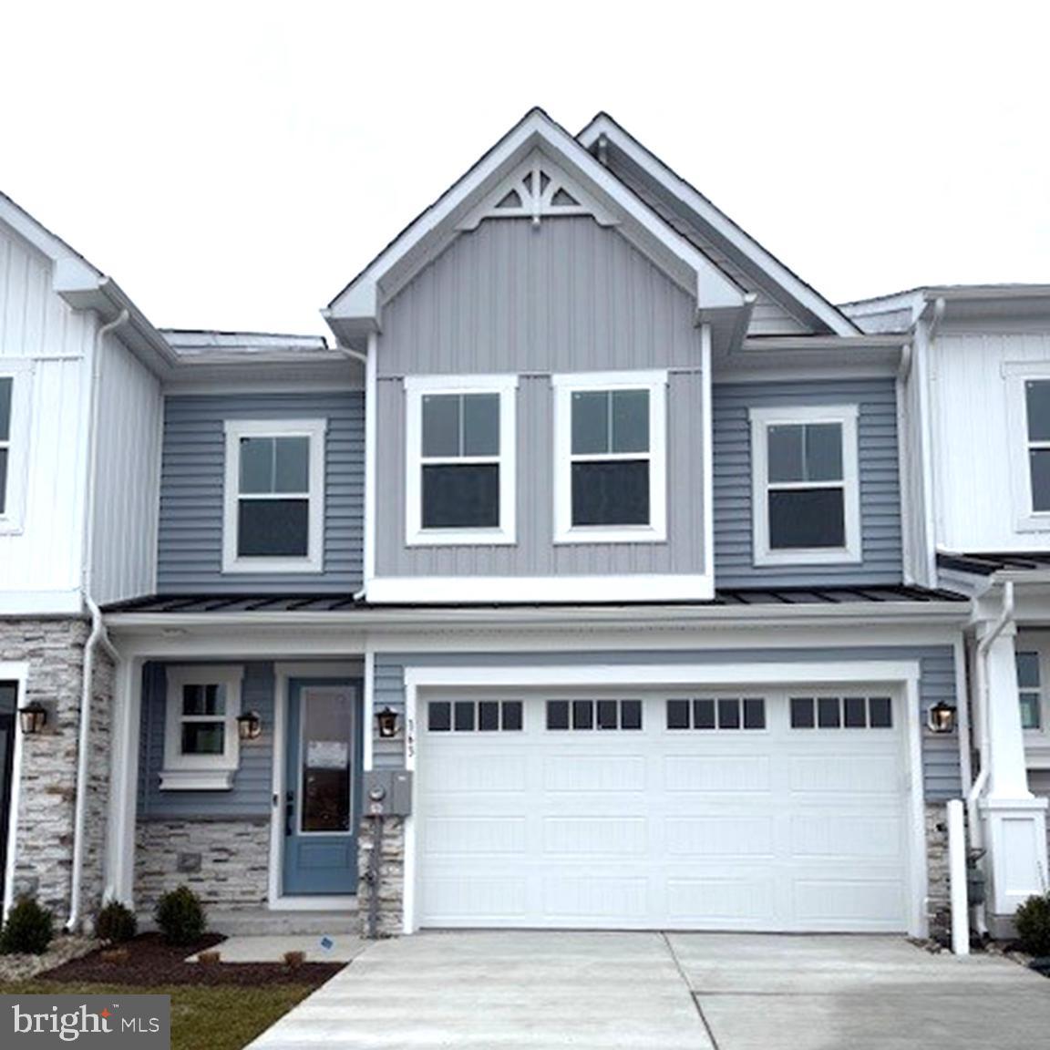 163 Merrick Way Ocean View, DE 19970 - Photo 1 of 10 a front view of a house with a garage
