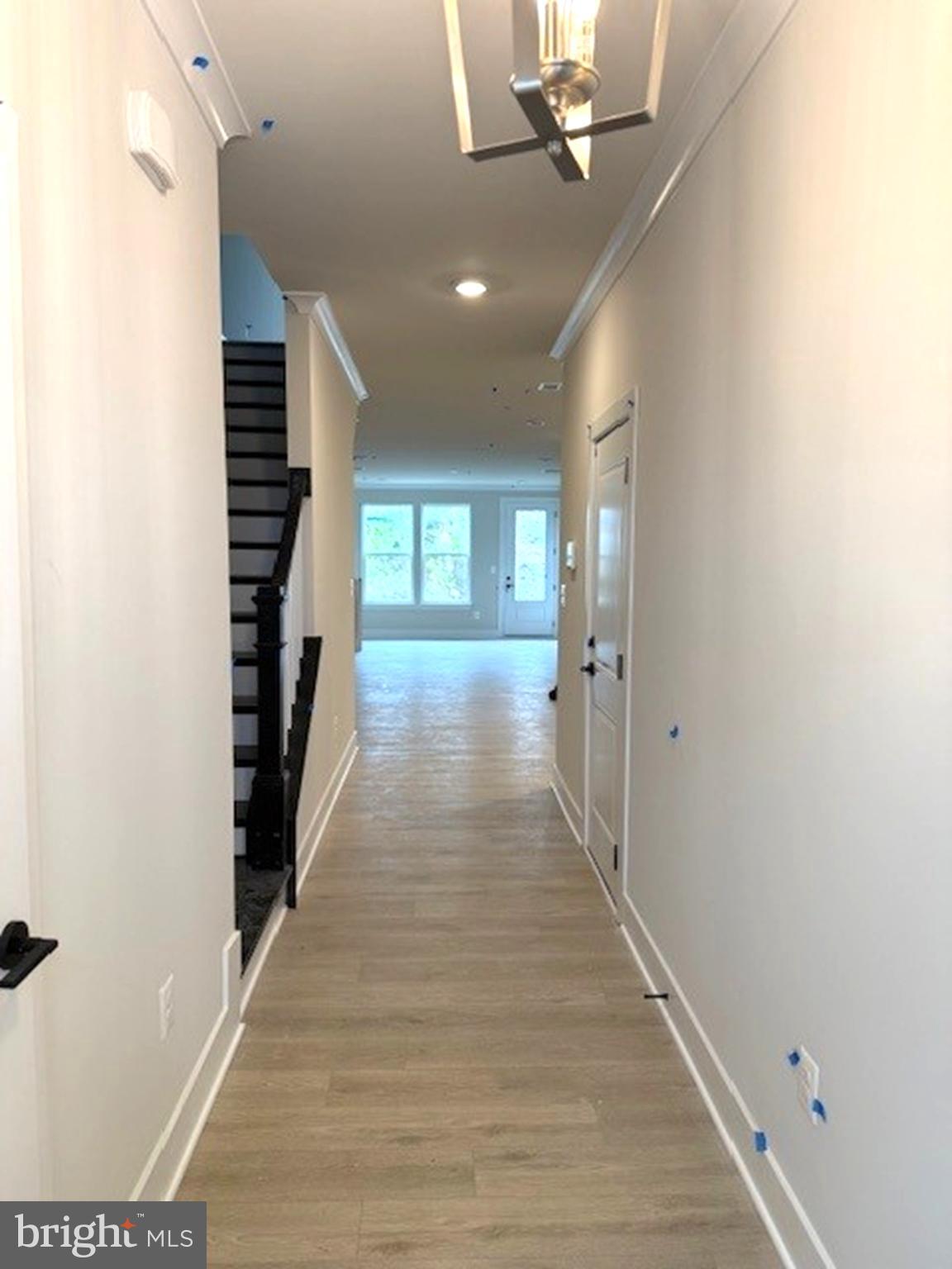 163 Merrick Way Ocean View, DE 19970 - Photo 2 of 10 a view of a hallway with wooden floor and entryway