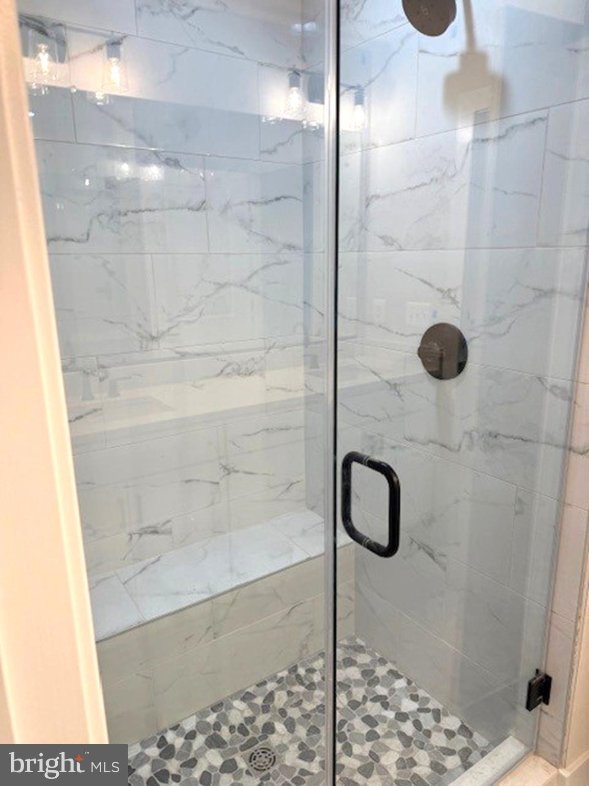 163 Merrick Way Ocean View, DE 19970 - Photo 7 of 10 a bathroom with a shower