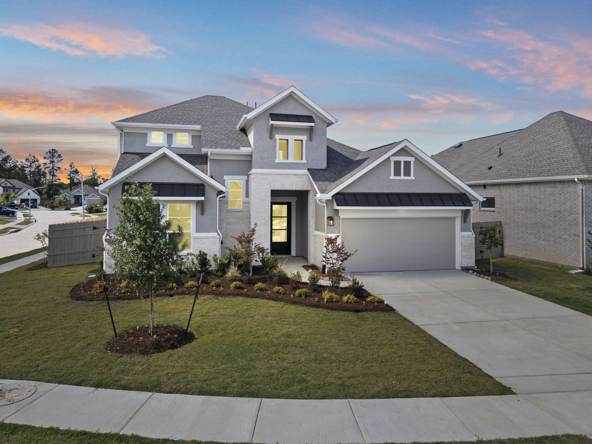 18103 Scarlett Hummingbird Court Conroe, TX 77302 - Photo 1 of 43 a front view of a house with a yard