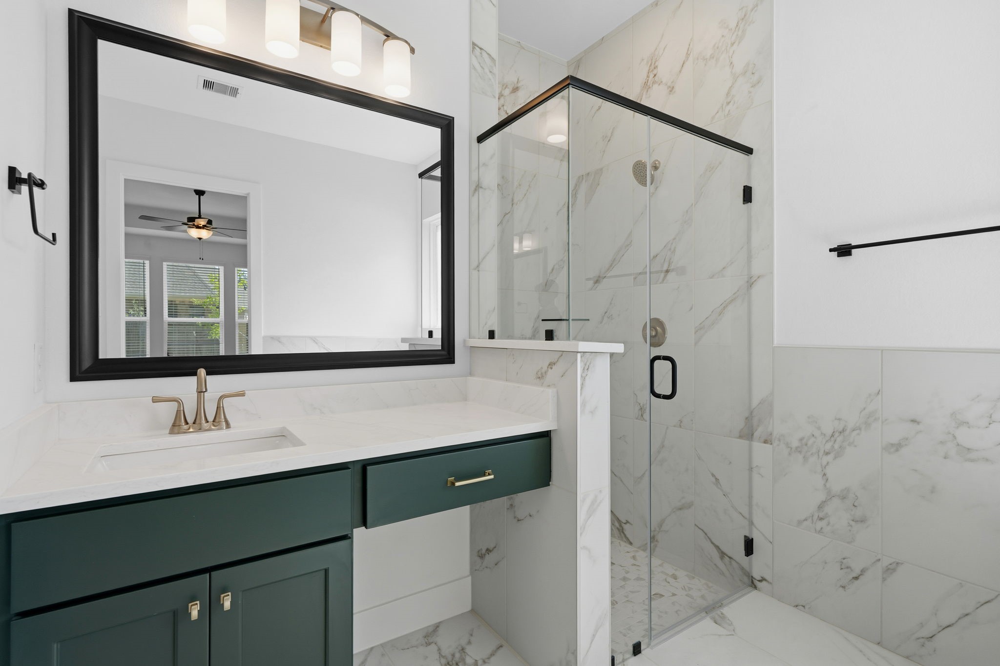 18103 Scarlett Hummingbird Court Conroe, TX 77302 - Photo 17 of 43 a bathroom with a sink and a mirror